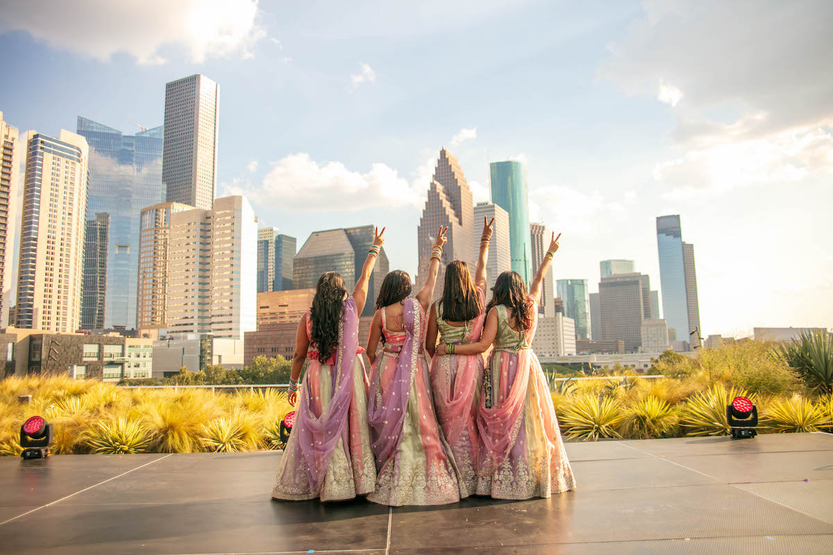 Performers take in the downtown Houston skyline from POST Houston’s Skylawn during the inaugural HTX Diwali celebration. | Photo by POST Houston