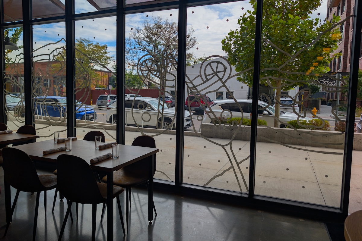The front of Risica is covered in floor-to-ceiling windows. | Photo by Linnea Covington