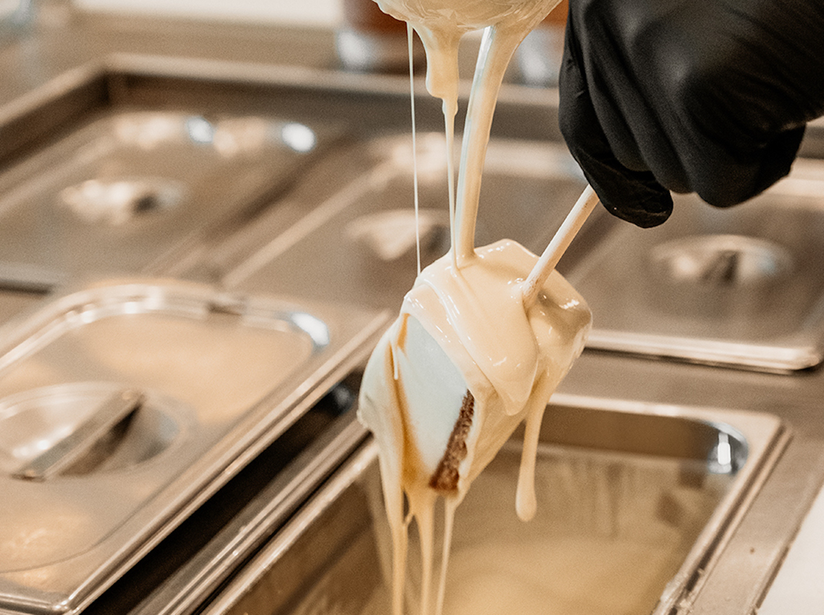 Drizzle Cheesecake DAL - DiningOut Each Drizzle Cheesecake slice is dipped and decorated by hand. | Photo by Drizzle Cheesecake