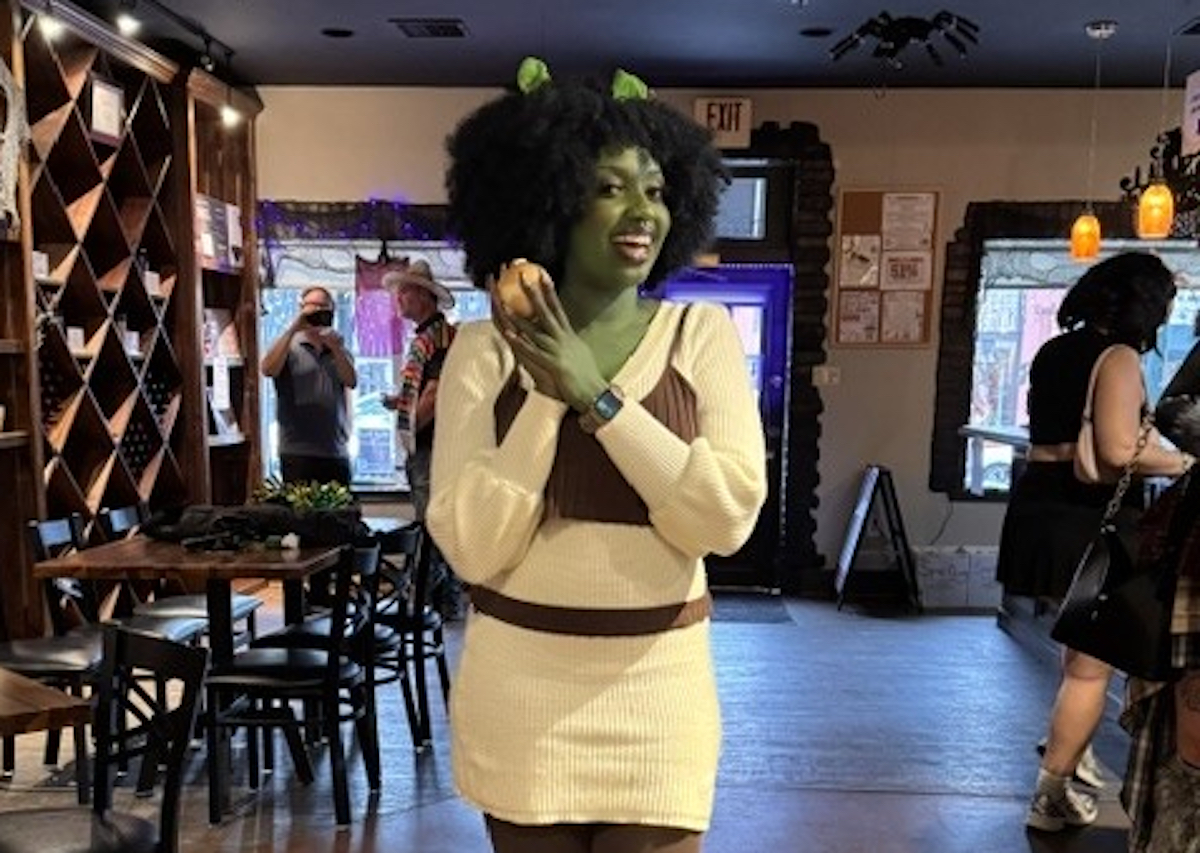 Grapevine DAL - DiningOut A costumed guest gets into the spooky spirit during Grapevine’s Hallowine Trail, which pairs Halloween fun with wine tastings and bites along Historic Main Street. | Photo by Visit Grapevine